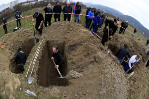 Gravediggers compete during a grave digging championship in Trencin, Slovakia